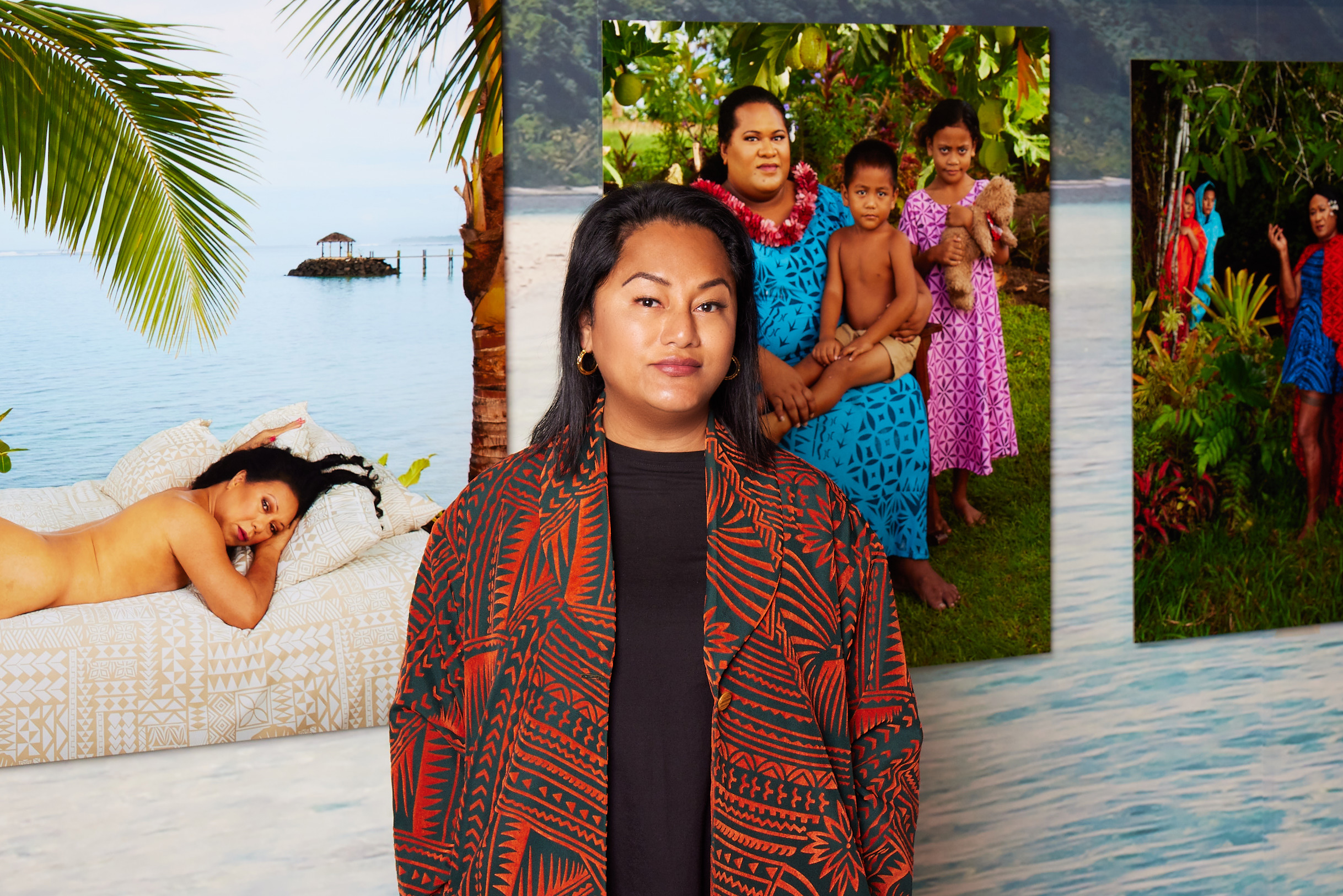 Interdisciplinary Artist Yuki Kihara standing in front of her "Paradise Camp" exhibition. (Photo by Luke Walker)