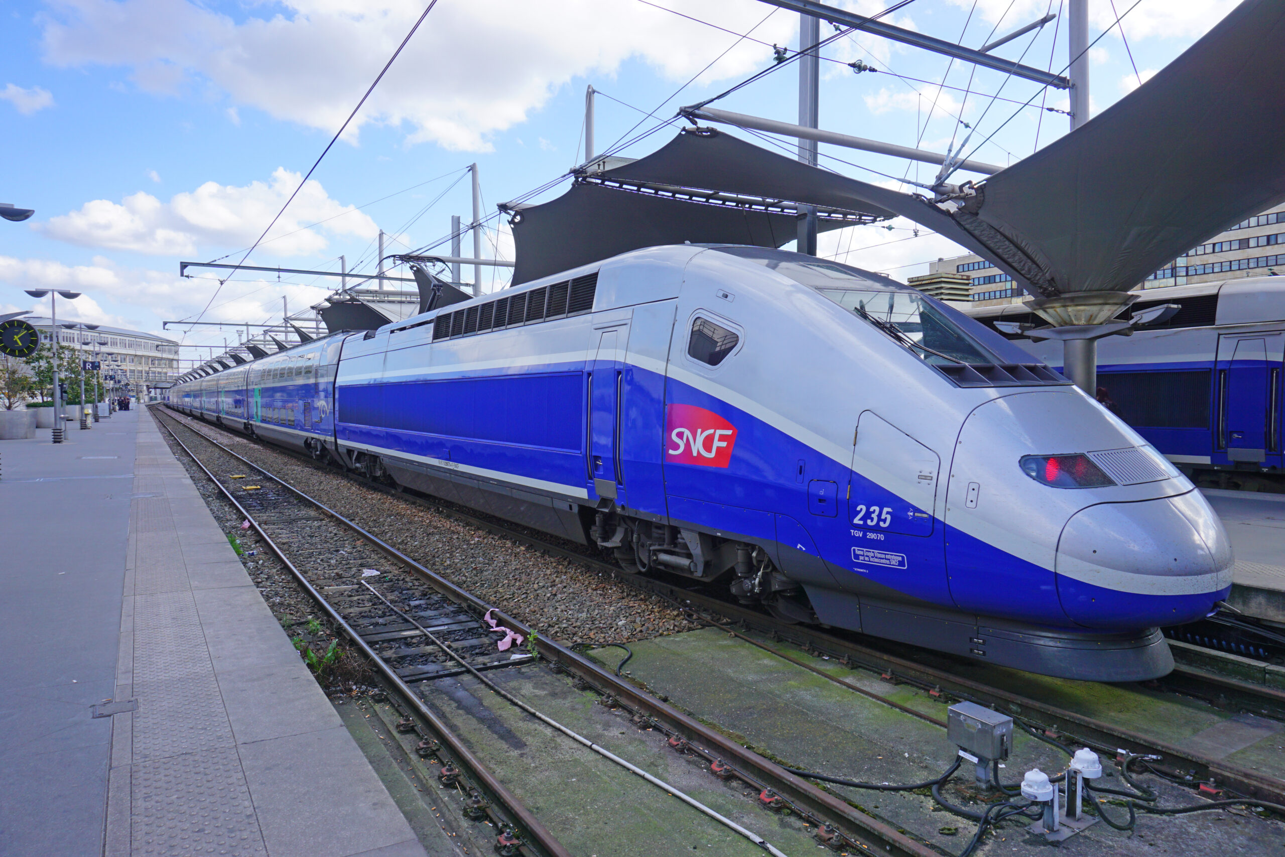Modern high-speed bullet TGV regional train leaves Paris. (Photo Credit: EQRoy / Shutterstock)