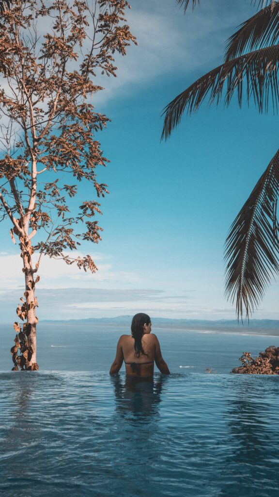 Hotel pool overlooking Manuel Antonio Beach (Photo Credit: Maximilien T'Scharner on Unsplash)