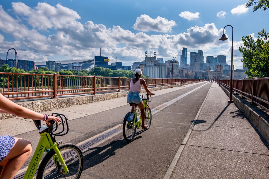 Bikers on the Stone Arch Bridge in Minneapolis (Photo Credit: CK Foto / Shutterstock)