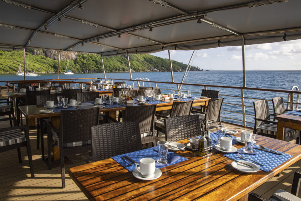 Table setting for breakfast in outdoor restaurant aboard cruise ship M/Y Pegasos (Photo Credit: Variety Cruises)