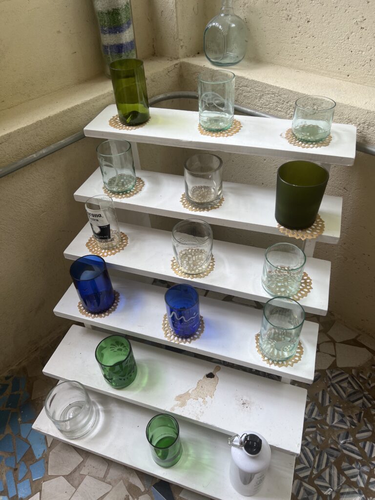 Different styles of drinking glasses made from recycled bottles or glass (Photo Credit: Blue Apple Beach)