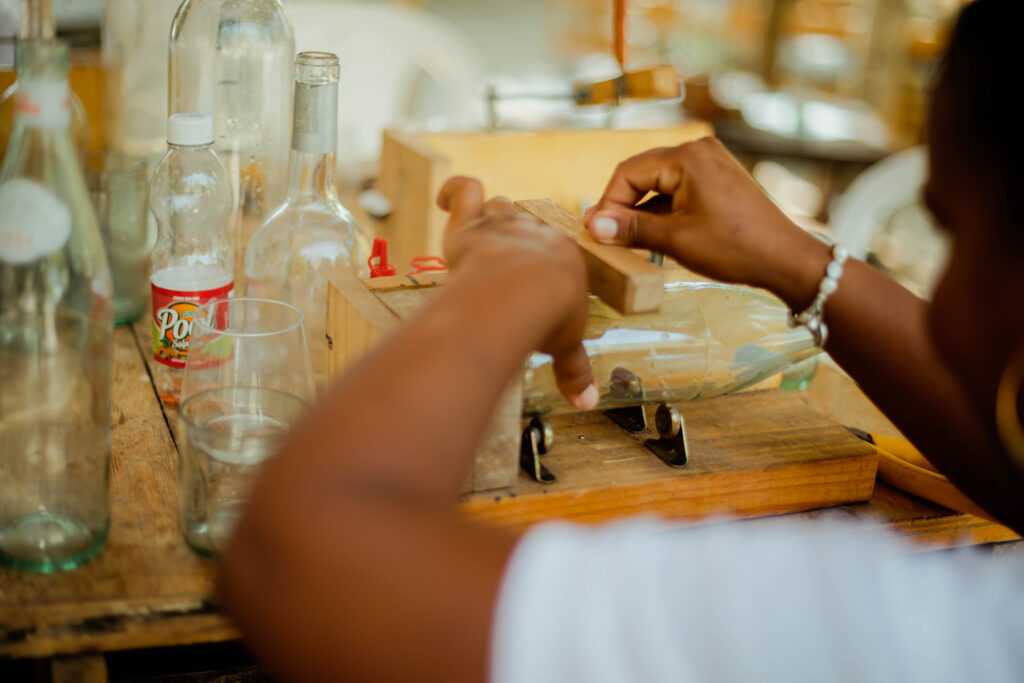 Local artisan in the workshop at Blue Apple Beach (Photo Credit: Blue Apple Beach)