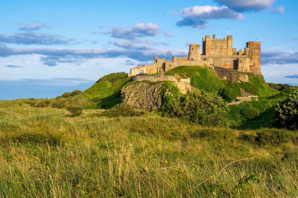 Bamburgh Castle in the Summer (Photo Credit: Philip Veater on Unsplash)