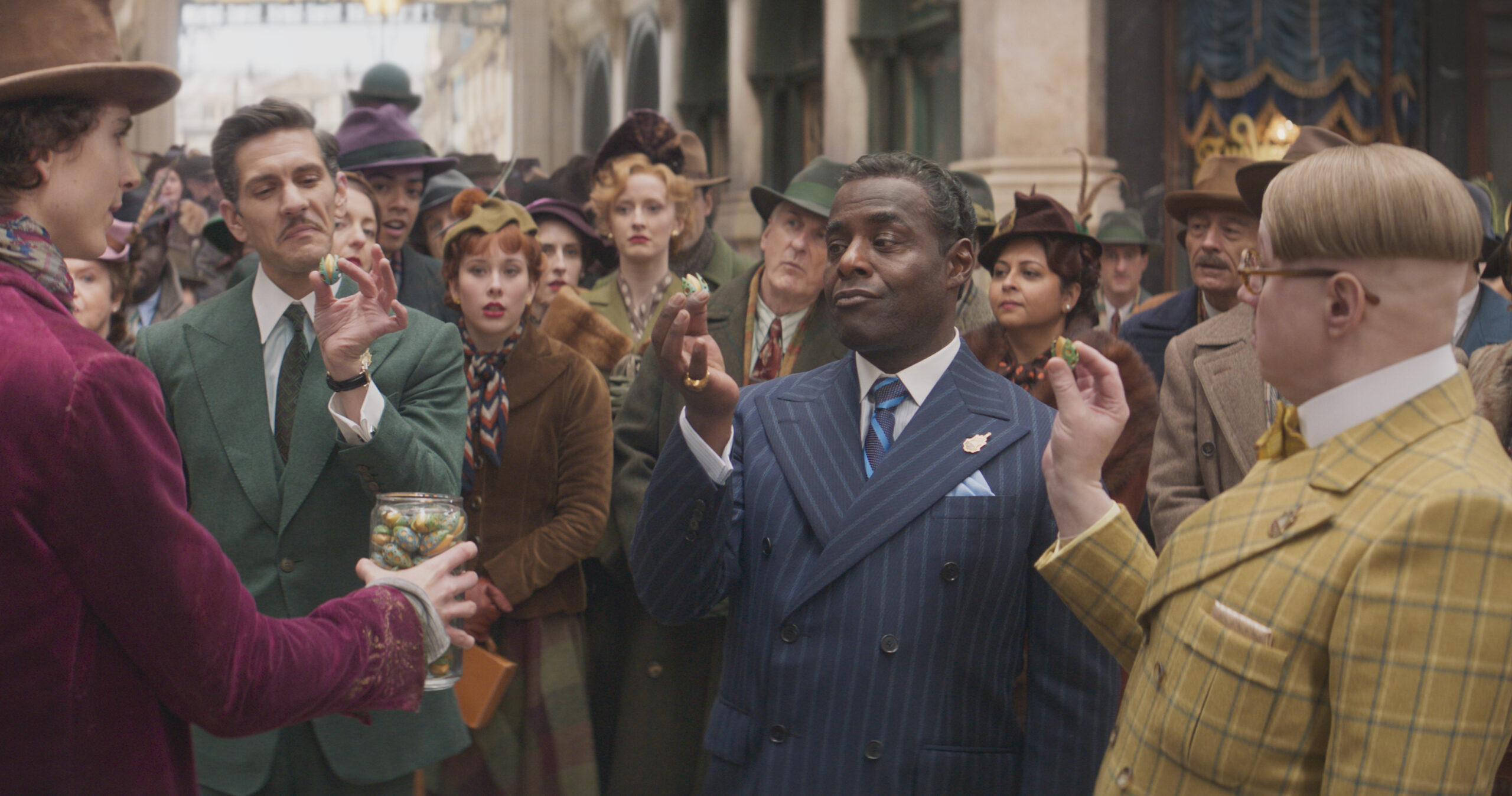 (L to r) Timothée Chalamet as Willy Wonka, Mathew Baynton as Fickelgruber, Paterson Joseph as Arthur Slugworth and Matt Lucas as Prodnose (Photo Credit: Courtesy of Warner Bros. Pictures)