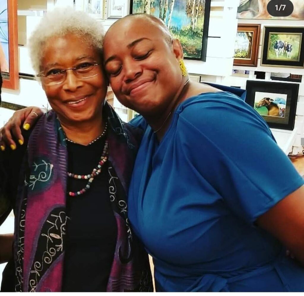 Tiffanie Barriere served cocktails and hugs Alice Walker during the author's 75th birthday celebration. (Photo Credit: Tiffanie Barriere)