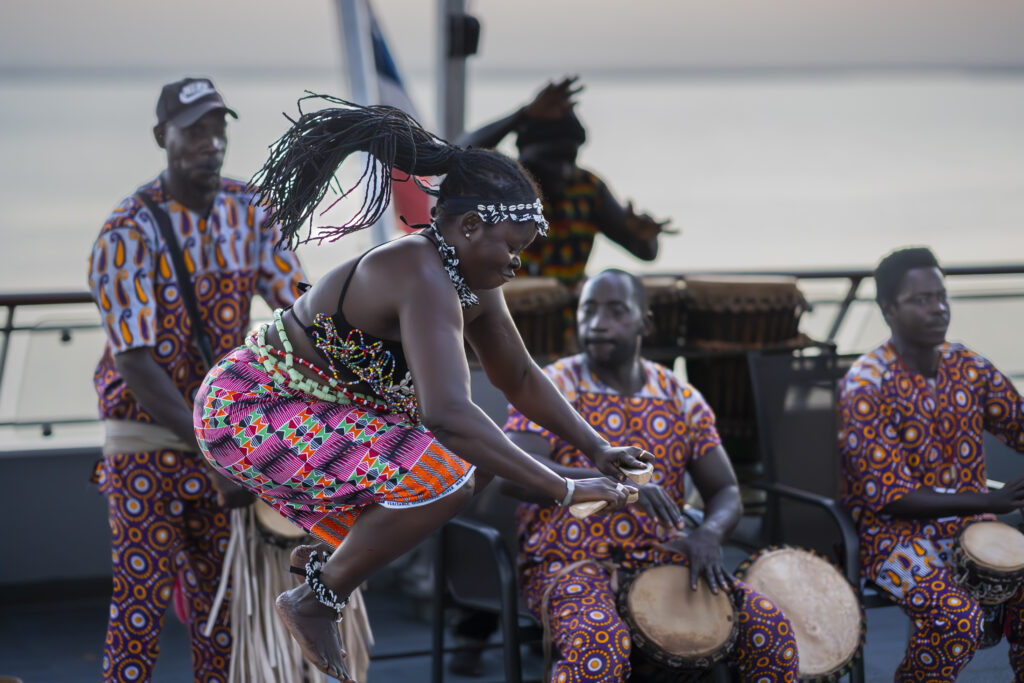 African dancers perform aboard the MS Spitsbergen in Banjul, Gambia (Photo Credit: Jan Hvizdal/Hurtigruten Expeditions)