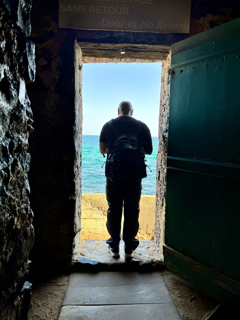 Kwin standing in The Door of No Return on  Gorée Island (Photo Credit: Sara Greaves-Gabbadon)